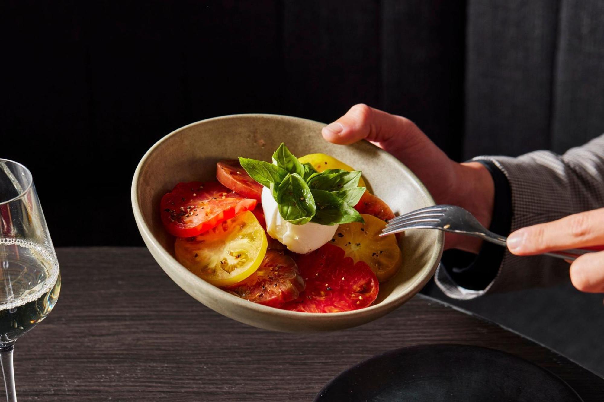 Melbourne Marriott Hotel Docklands Bagian luar foto A tomato salad with mozzarella and basil
