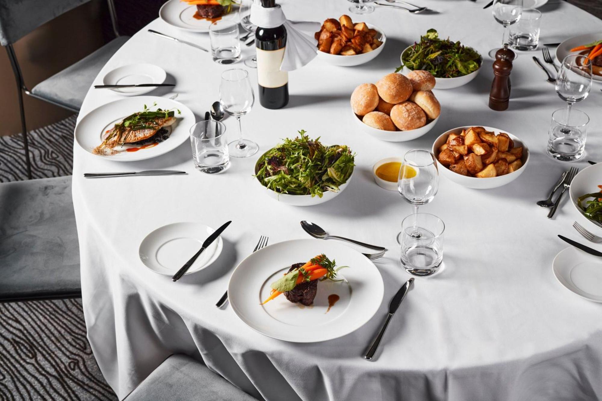Melbourne Marriott Hotel Docklands Bagian luar foto A table set for a formal dinner